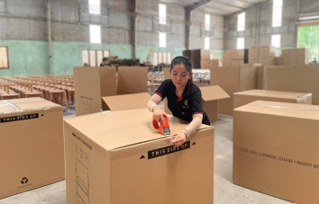 Workers are working at inspection and packing area